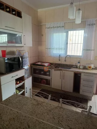 Imagem Sobrado com 2 dormitórios à venda, 79 m² por R$ 318.000 - Oceanópolis - Mongaguá/SP