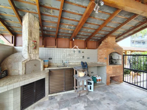 Imagem Casa no condomínio Granville 4 suítes, 2 salas, 806,4 m2 de área, 6 vagas de garagem no Guarujá-SP