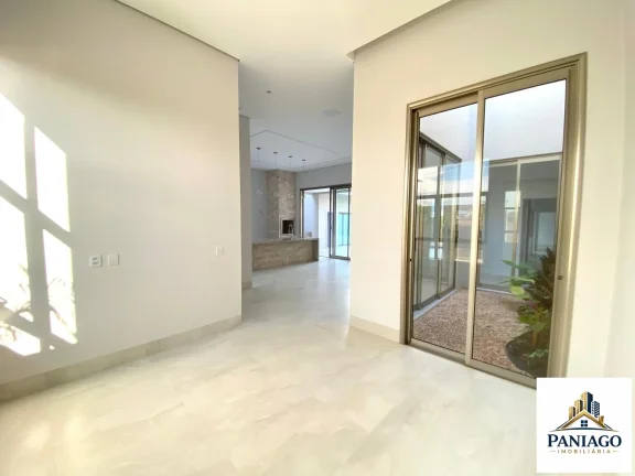 Imagem Casa de alto padrão com 3 suítes, cozinha gourmet e piscina com cascata