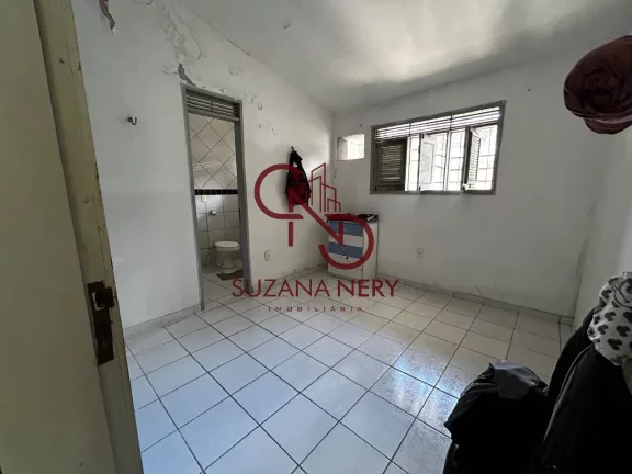 Imagem Prédio comercial com uma casa, 2 lojas e 11 kitinets