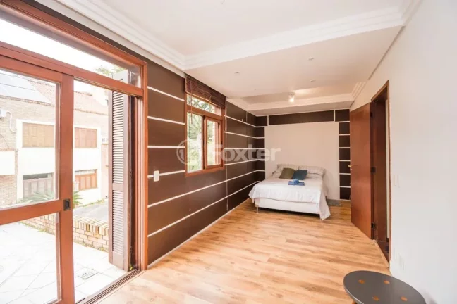 Imagem Casa em Condomínio 3 dorms à venda Avenida Vicente Monteggia, Cavalhada - Porto Alegre