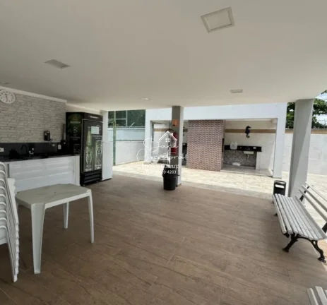 Imagem Aluguel de apartamento no Jardim Astúrias, Guarujá-SP: 2 quartos, 1 suíte, 2 salas, 2 banheiros, 1 vaga de garagem, 85m² de área.