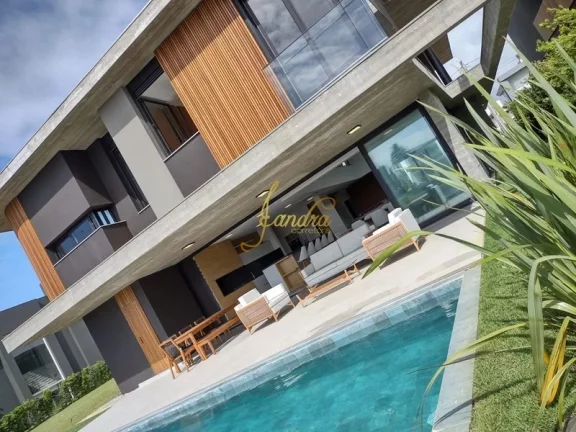 Imagem Belíssima Sobrado no Condomínio Enseada! Estilo Contemporâneo, composto por 05 suítes com sacada