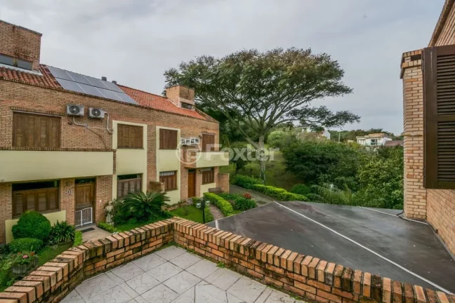 Imagem Casa em Condomínio 3 dorms à venda Avenida Vicente Monteggia, Cavalhada - Porto Alegre