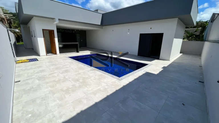 Imagem CASA EM CONDOMINIO FECHADO COM 4 DORMITÓRIOS SENDO 4 SUÍTES,2 VAGAS DE GARAGEM,VARANDA GOURMET COM CHURRASQUEIRA E PISCINA.