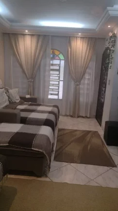 Imagem Sobrado à venda em Santo André-SP: 3 quartos, 2 banheiros, 2 vagas de garagem, 188m² no Jardim Las Vegas!