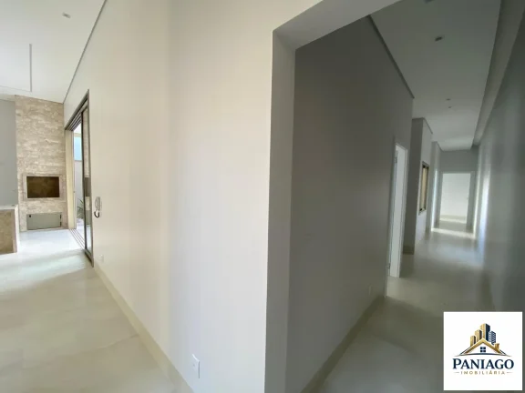 Imagem Casa de alto padrão com 3 suítes, cozinha gourmet e piscina com cascata