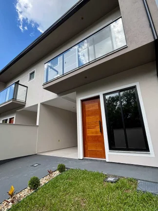 Imagem Casa com 2 dormitórios sendo 2 suítes e 1 vaga de garagem em São José/SC