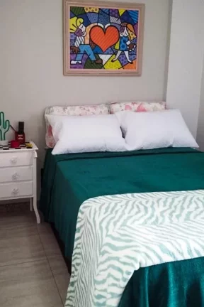 Imagem Flat com 3 dormitórios à venda, 112 m² por R$ 700.000,00 - Pitangueiras - Guarujá/SP
