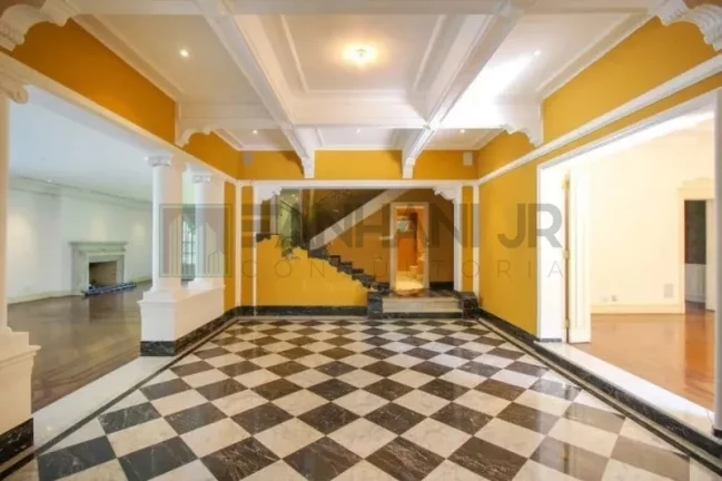 Imagem Luxuosa casa de alto padrão de 4 suítes no Jardim América: 6 salas, 8 banheiros, 12 vagas de garagem e 1.029m² de área em SP.