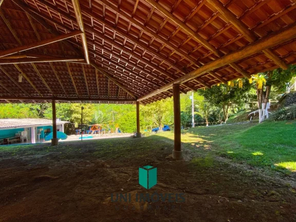 Imagem Chácara com 10 suítes e Cachoeira a venda, 9.104M² na zona rural de Guarapari.