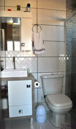 Imagem Casa de 3 Dormitórios sendo 2 Suítes, vaga para 2 carros com pátio.