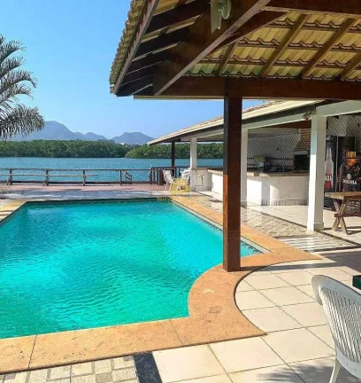 Imagem Casa de Luxo Exclusiva com Marina Privativa no Canal de Guarapari
Descubra esta residência de alto ...