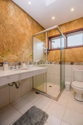 Imagem Casa em Condomínio 3 dorms à venda Avenida Vicente Monteggia, Cavalhada - Porto Alegre