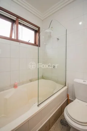 Imagem Casa em Condomínio 3 dorms à venda Avenida Vicente Monteggia, Cavalhada - Porto Alegre