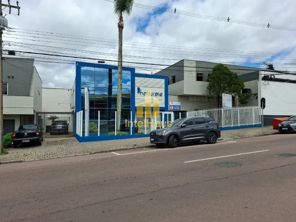 Imagem Imóvel comercial à venda em localização estratégica no Bacacheri, em terreno de esquina com gra...