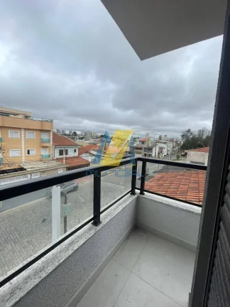 Imagem Apartamento com 2 dormitórios (1 suíte), sacada, elevador, 1 vaga. Novo