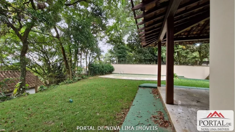 Imagem Casa a venda no condomínio Ipê da Serra, casa com armário e área de lazer com piscina. Venha conhecer no Portal de Nova Lima Imóveis - 31.98511-8000