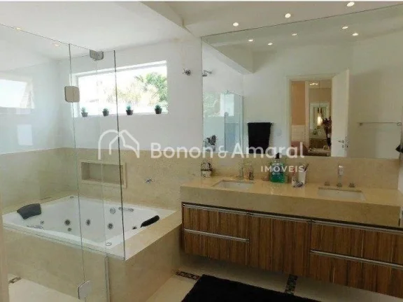 Imagem Casa em condomínio com 410 m² e 4 quartos