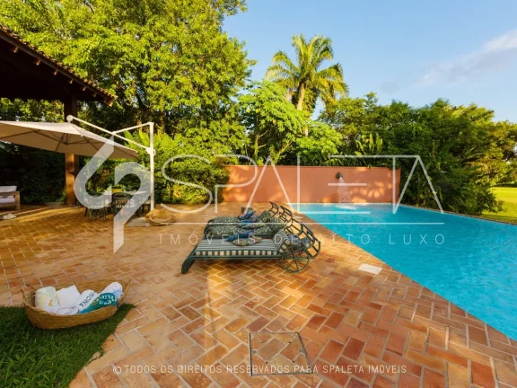 Imagem Lindíssima residência com golfe no quintal e vista sensacional para o lago à venda no Guarujá Golf Club