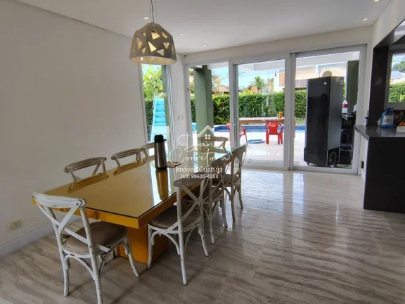 Imagem Casa de luxo em condomínio na Enseada, Guarujá-SP: 5 quartos, 5 suítes, 2 salas, 4 vagas e 390m² de área. Imperdível!