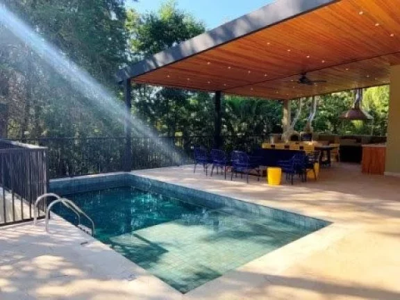 Imagem Casa de Condomínio com 5 Quartos e 6 banheiros, 405 m².