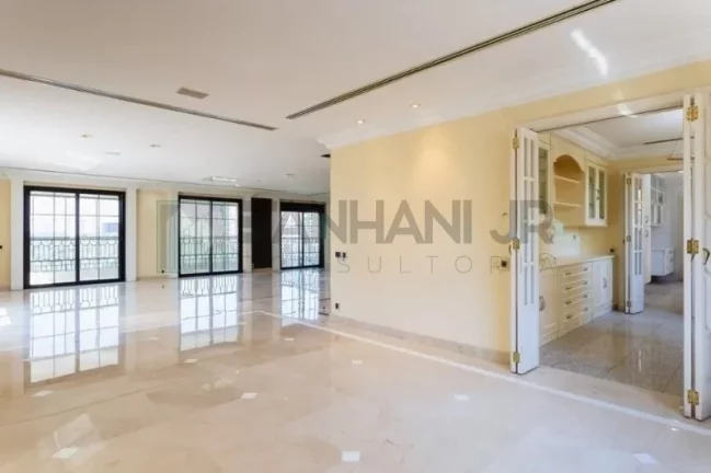 Imagem Com uma área privativa de 315m2, este apartamento luxuoso conta com um espaçoso living para três ambientes, sala de jantar e sala de almoço, além de u