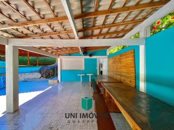 Imagem Chácara com 10 suítes e Cachoeira a venda, 9.104M² na zona rural de Guarapari.