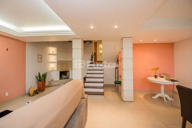 Imagem Casa em Condomínio 3 dorms à venda Avenida Vicente Monteggia, Cavalhada - Porto Alegre