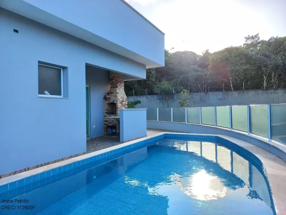 Imagem Casa nova com 4 suítes, piscina e fino acabamento à venda em condomínio de luxo em Peruíbe.