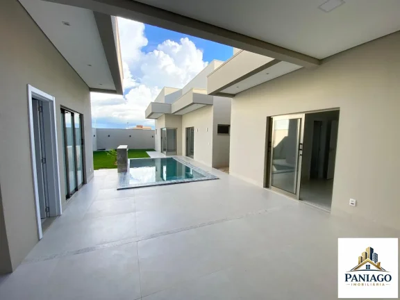 Imagem Casa de alto padrão com 3 suítes, cozinha gourmet e piscina com cascata