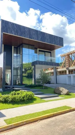 Imagem Casa nova no Condomínio Caledônia com 5 suítes e 4 vagas de garagem em Camboriú-SC