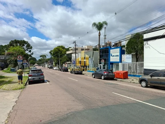 Imagem Imóvel comercial à venda em localização estratégica no Bacacheri, em terreno de esquina com gra...