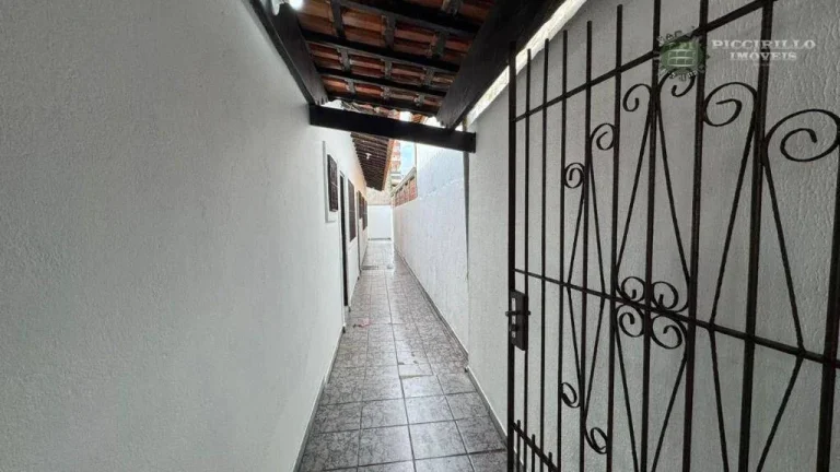 Imagem Casa com 3 dormitórios à venda, 71 m² por R$ 590.000 - Vila Guilhermina - Praia Grande/SP