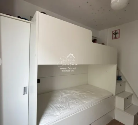 Imagem Aluguel de apartamento no Jardim Astúrias, Guarujá-SP: 2 quartos, 1 suíte, 2 salas, 2 banheiros, 1 vaga de garagem, 85m² de área.