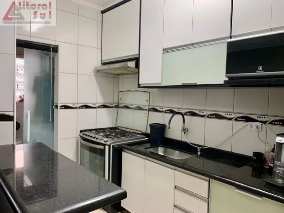 Imagem Apartamento à venda em Praia Grande-SP, bairro Ocian: 2 quartos, 1 suíte, 1 sala, 2 banheiros, 64m², garagem. Venha conferir!