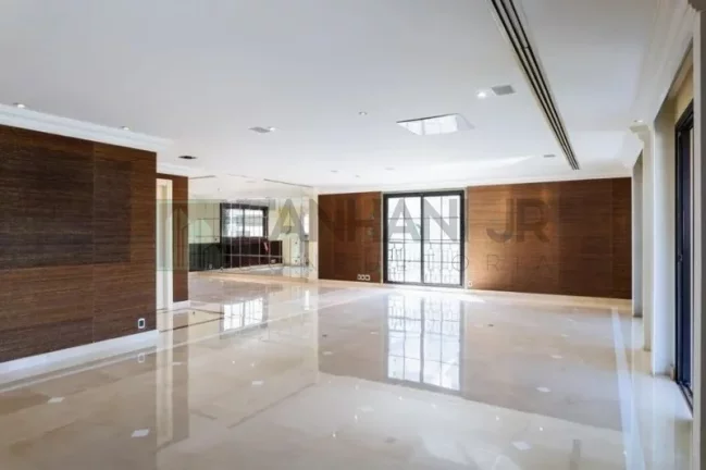 Imagem Com uma área privativa de 315m2, este apartamento luxuoso conta com um espaçoso living para três ambientes, sala de jantar e sala de almoço, além de u