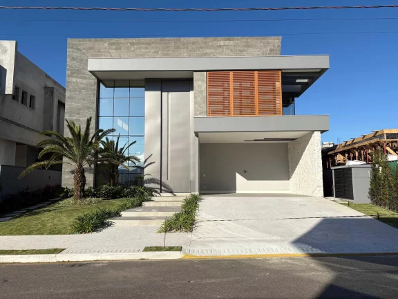 Imagem Casa em condomínio com 4 suítes e 4 vagas de garagem em Camboriú/SC
