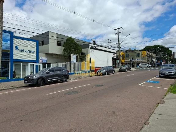Imagem Imóvel comercial à venda em localização estratégica no Bacacheri, em terreno de esquina com gra...