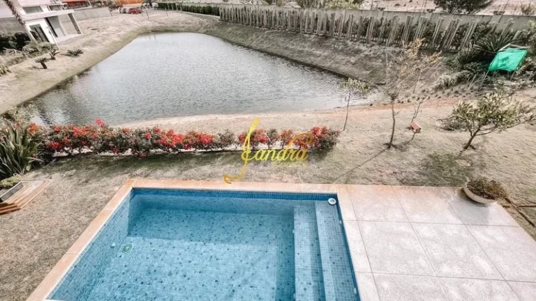 Imagem Casa térrea com 3 suítes e beira de lago com piscina