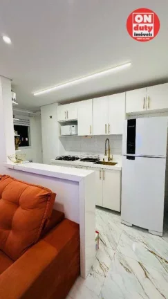 Imagem Apartamento com 2 dormitórios à venda, 46 m² por R$ 340.000,00 - Areia Branca - Santos/SP