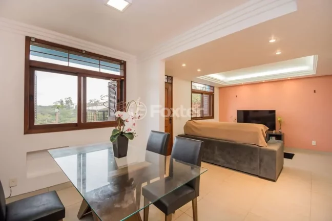 Imagem Casa em Condomínio 3 dorms à venda Avenida Vicente Monteggia, Cavalhada - Porto Alegre