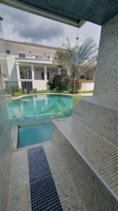 Imagem Mansão de Luxo no Condomínio Flamboyant: Exclusividade e Sofisticação em At