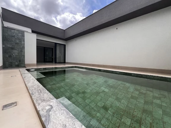 Imagem Casa Alto Padrão à Venda no Alto dos Caiçaras – 3 Suítes, Piscina e Área Gourmet em Patos de Minas