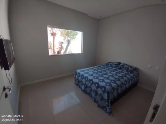 Imagem Casa de Alto Padrão na Aruana: 5 quartos, 4 suítes, posição Leste - Confira!