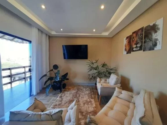 Imagem Elegante Casa com Área de Lazer, Três Dormitórios e Suítes