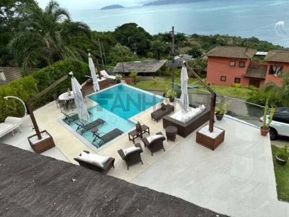 Imagem Deslumbre-se com esta incrível oportunidade de adquirir uma casa dos sonhos no exclusivo condomínio Yacamim, localizado em Ilhabela. Com uma vista esp