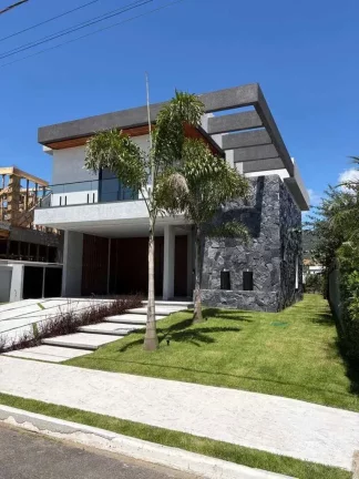 Imagem Casa alto padrão em condomínio com 4 suítes e 4 vagas de garagem em Camboriú/SC