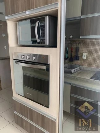 Imagem APARTAMENTO NO BOQUEIRÃO FRENTE MAR COM VARANDA E PORTEIRA F